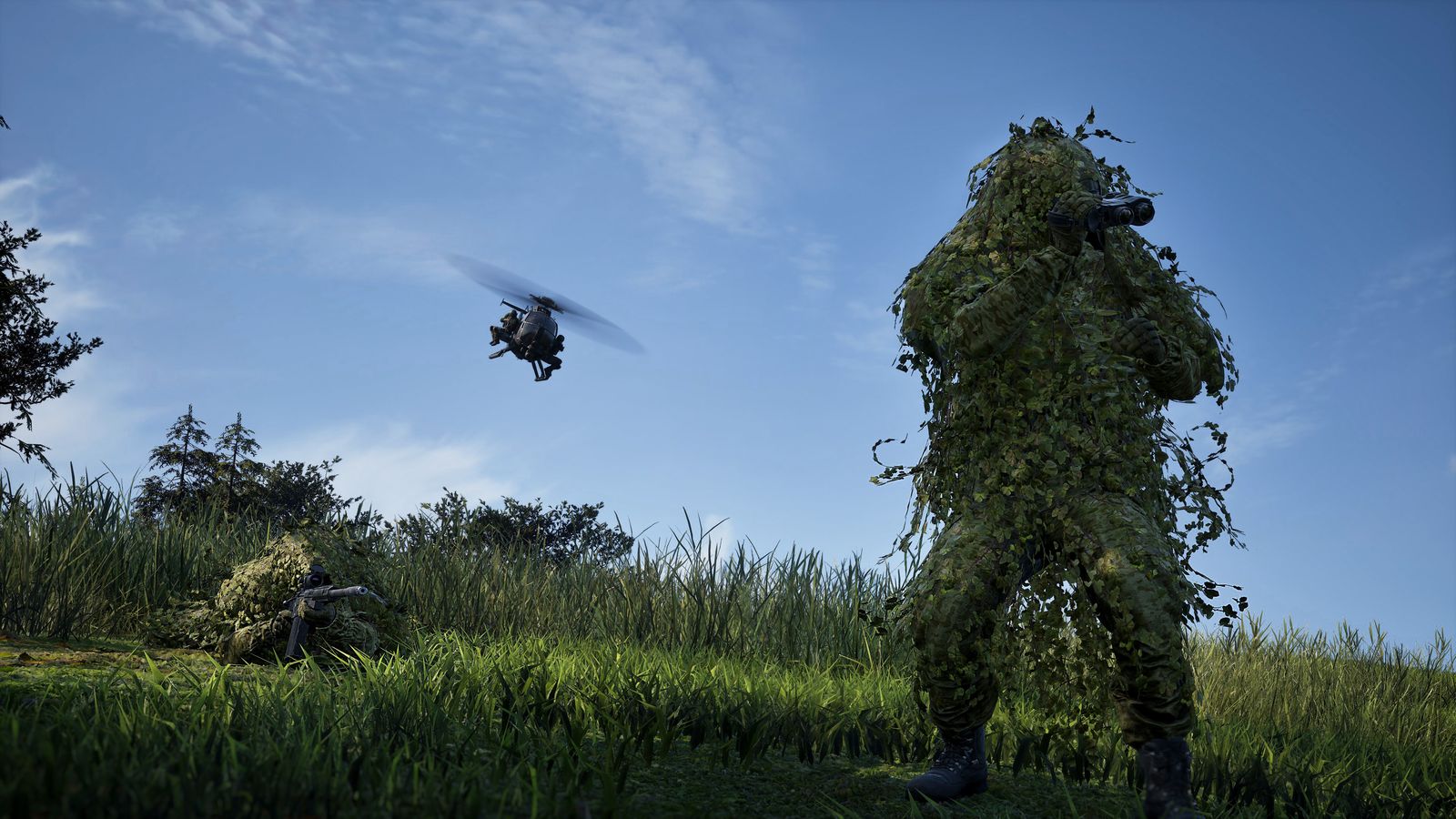 A WARDOGS player in a ghillie suit standing in tall grass with a helicopter in the sky behind