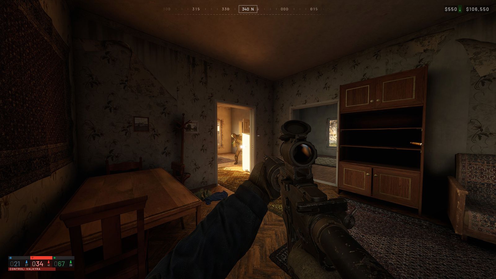First-person view inside a dim, abandoned house interior in WARDOGS, holding a scoped rifle, light coming through a doorway