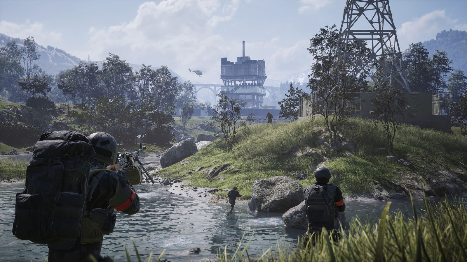 WARDOGS soldiers wading through a river toward an industrial site with a tall pylon, a helicopter overhead